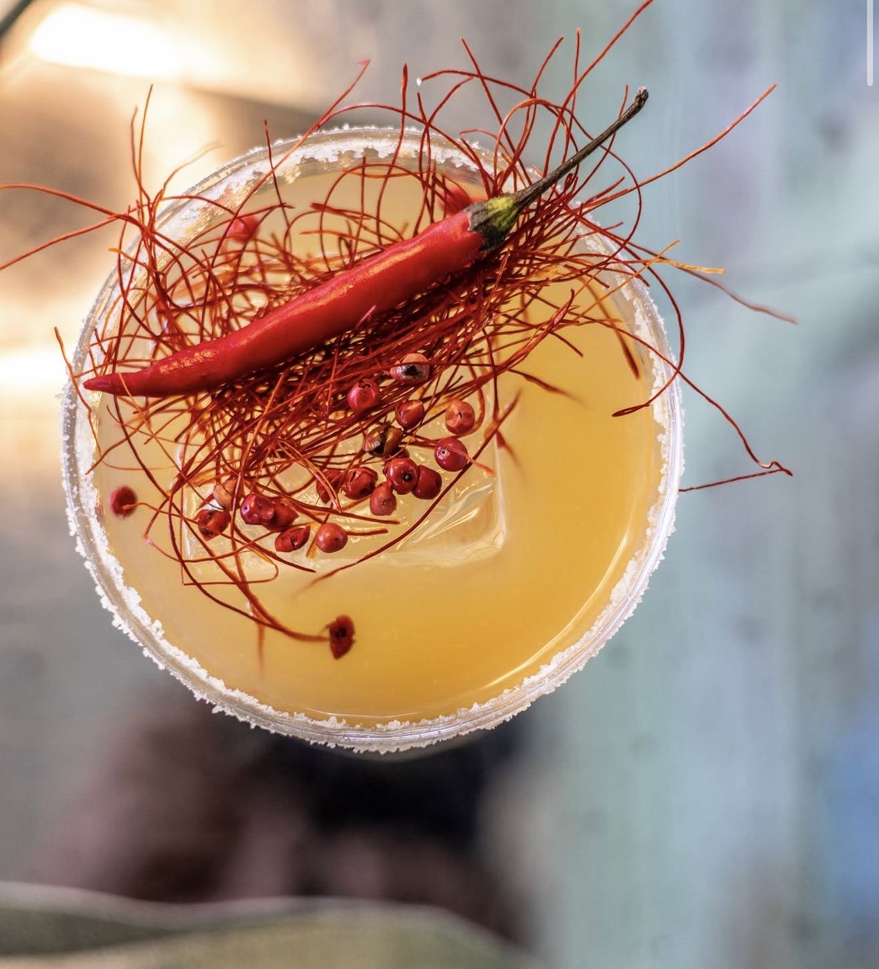 Cocktail with chilli and red garnish