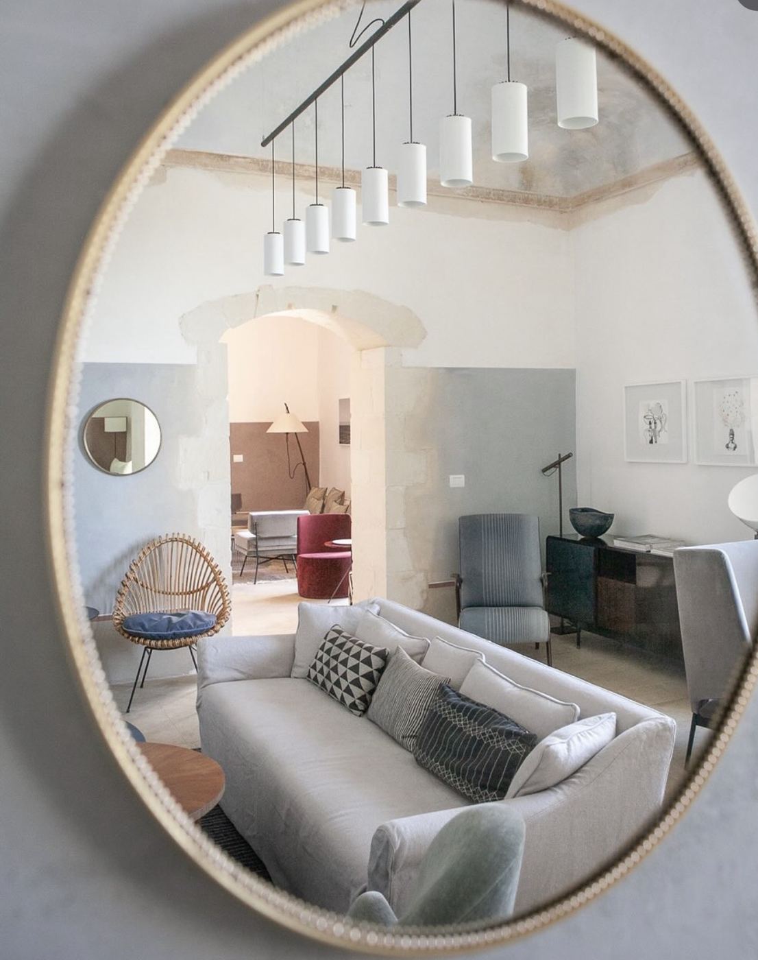 Contemporary Sicilian interior seen through a round mirror